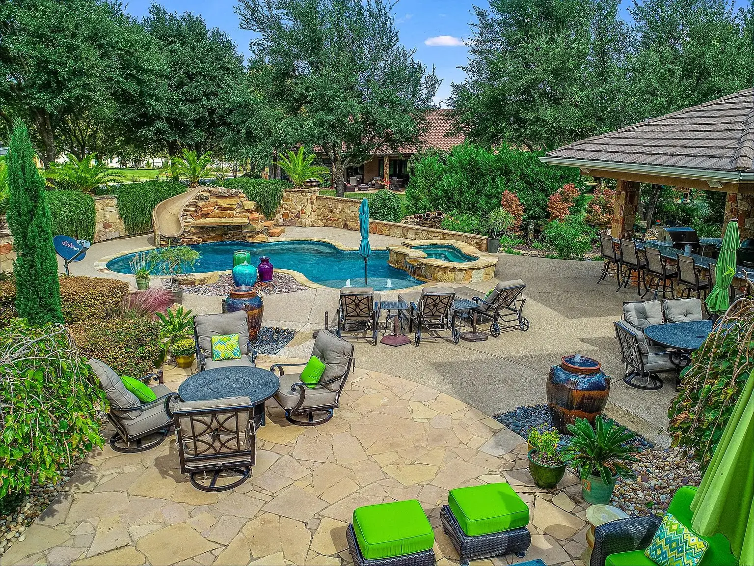 Backyard with pool, dining patio and cabana