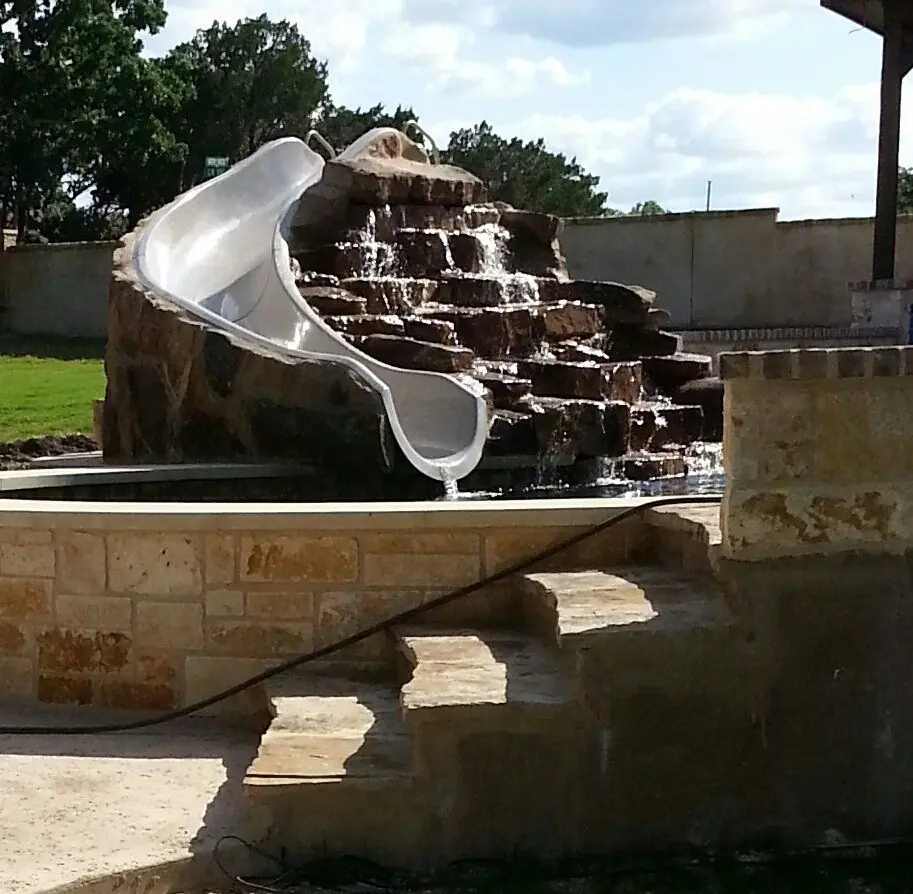 Stone waterfall with slide
